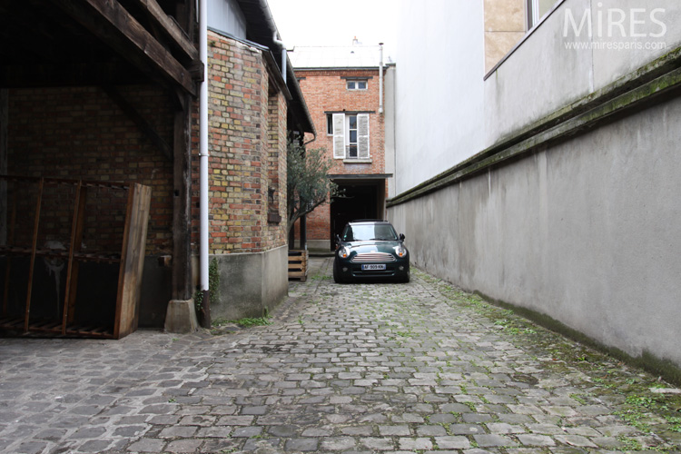 C0607 – Cobblestone courtyard and wooden shed