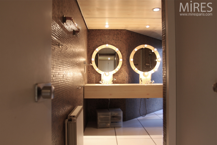 Round mirrors and brown mosaic. C0665