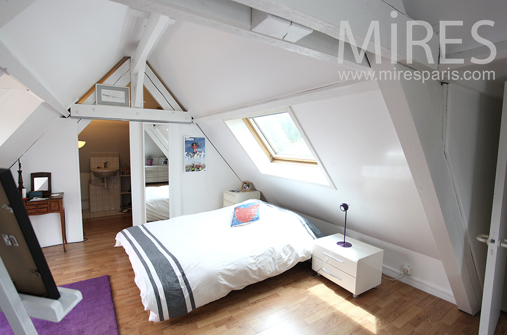 White mansard-roofed room. C1465