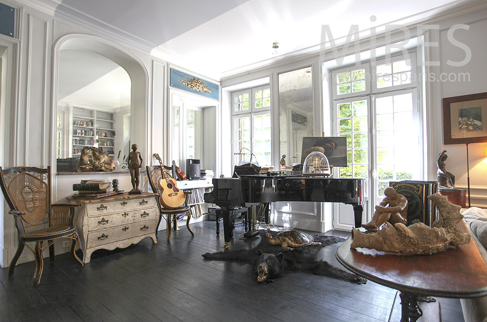 Black piano on bear skin. C1568