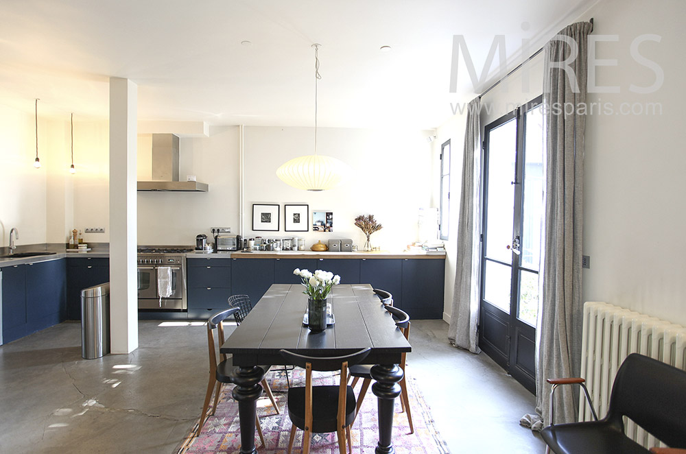 Black table in spacious kitchen. c1614