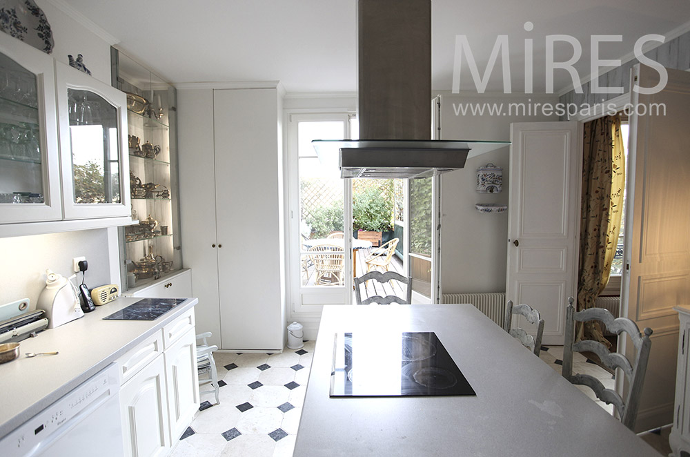 White kitchen overlooking terrace. c1617