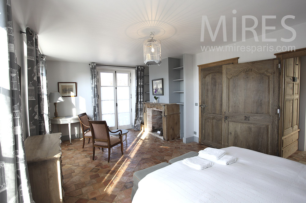 Room with fireplace and old wooden doors. c1630