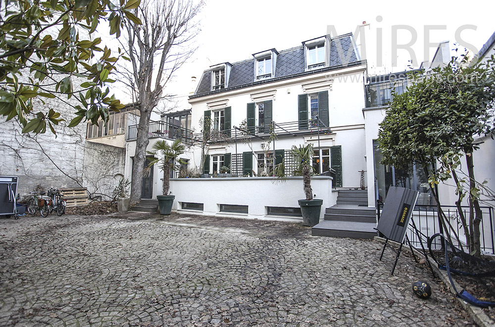 Paved entry courtyard. c1640