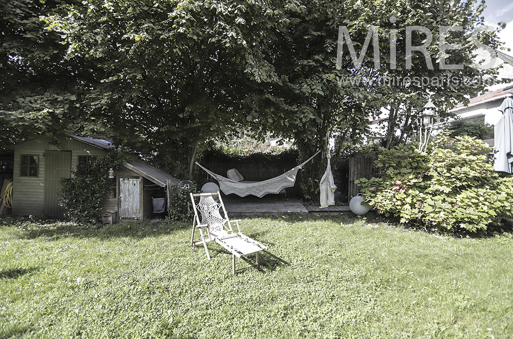 C1945 – Garden with hut and hammock