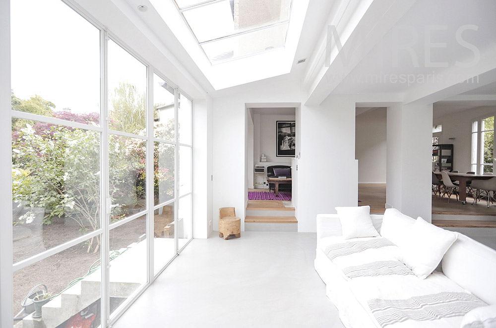 C1991 – White living room with glass wall