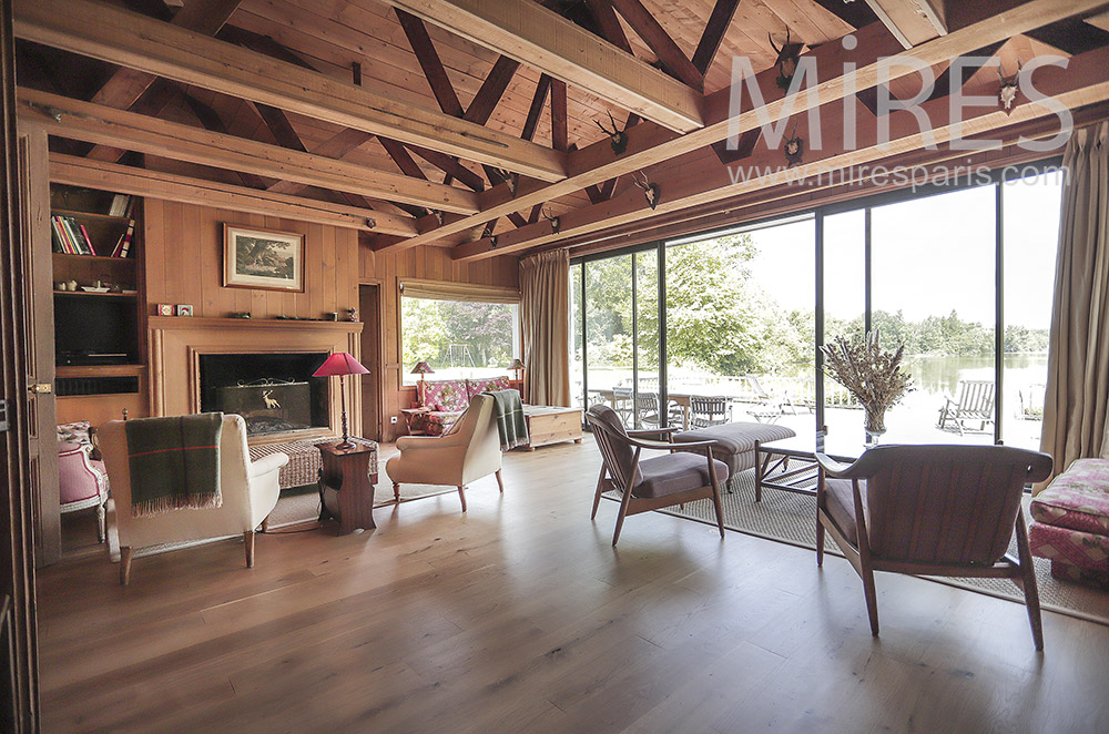 Large wooden living room opening onto the terrace. C0296