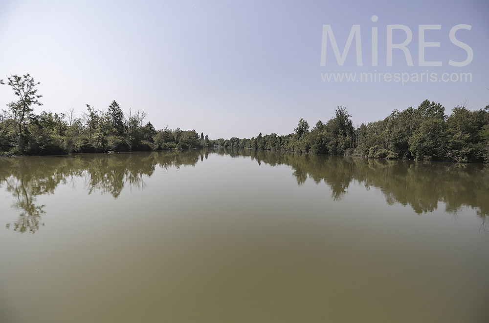 Pond lined with trees. C0296