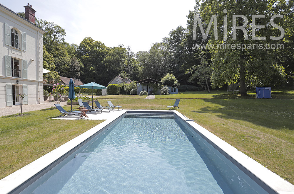 Swimming pool bordered by lawn. C1028