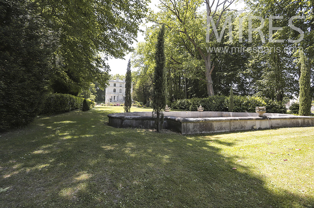 Park lined with trees. C2113